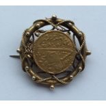 A gold Islamic coin mounted as a brooch. Approx. 8