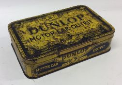 A "Dunlop Motor Car Outfit" tin. (1).