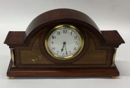 An Edwardian dome top mantle clock with inlaid dec