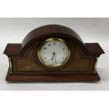 An Edwardian dome top mantle clock with inlaid dec