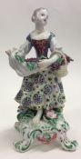 A decorative Bow figure of a lady in floral dress
