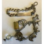 A silver curb link charm bracelet together with an