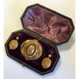 A boxed gold Victorian dome brooch together with m