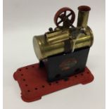 A Mamod steam engine on red base with burner. Est.