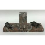 A pair of marble book ends mounted with animals. E