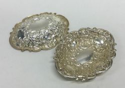 A pair of heavy silver cast bonbon dishes. Approx.