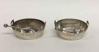 A pair of Victorian urn shaped silver salts with m