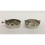 A pair of Victorian urn shaped silver salts with m