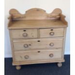 A good pine chest of four drawers with wavy edge o