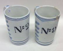 A pair of unusual Continental shaving mugs numbere