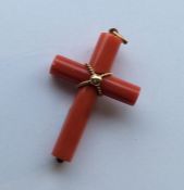 An unusual gold mounted coral cross with hinged to