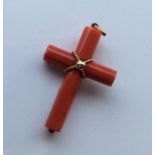 An unusual gold mounted coral cross with hinged to