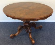 A good Victorian figured walnut tilt-top Loo table