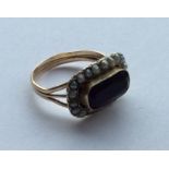 An Antique amethyst and pearl cluster ring in 9 ca