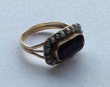 An Antique amethyst and pearl cluster ring in 9 ca