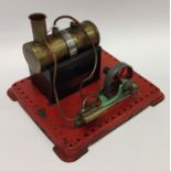 A Mamod steam engine on red base with burner. Est.