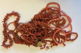 A heavy bag of miscellaneous coral and other beads