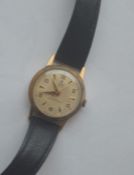 A 9 carat Tudor wristwatch in gold case and leathe