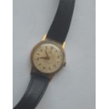 A 9 carat Tudor wristwatch in gold case and leathe