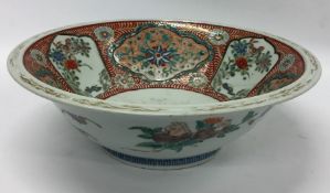 A large Chinese fruit bowl decorated with flowers