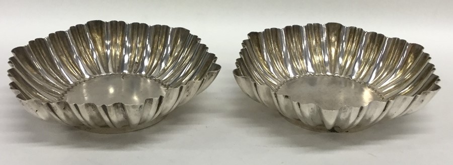 A pair of fluted silver sweet dishes on pedestal b