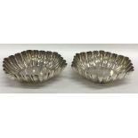 A pair of fluted silver sweet dishes on pedestal b