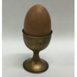 A novelty silver musical box in the form of an egg