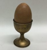 A novelty silver musical box in the form of an egg