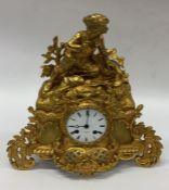 A good French gilt mantle clock with finial top. E