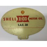 A small oval "Shell X-100 Motor Oil S.A.E 20" doub