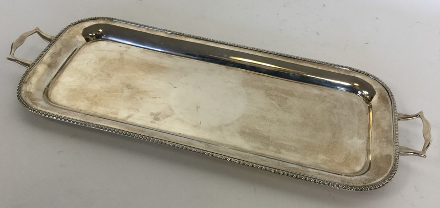 A heavy rectangular silver sandwich tray with gadr