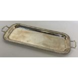 A heavy rectangular silver sandwich tray with gadr