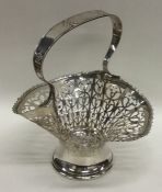 An Edwardian pierced silver basket with wavy edge.