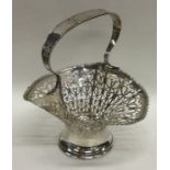 An Edwardian pierced silver basket with wavy edge.