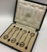 A boxed set of six silver bean top coffee spoons.