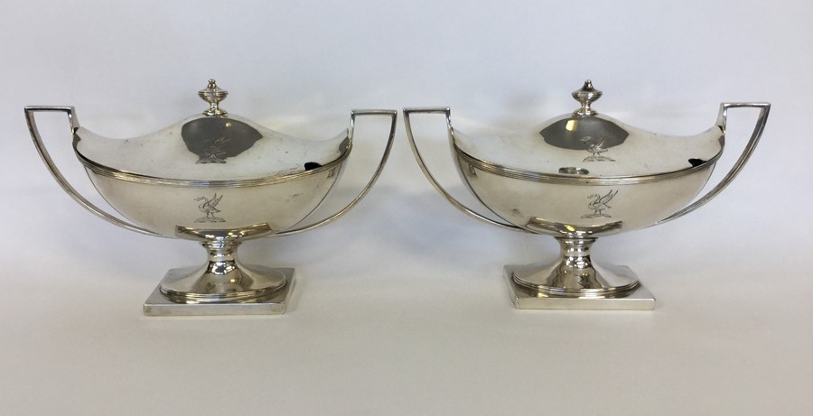 A good pair of Georgian silver tureens and covers
