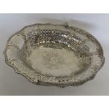 An oval George III silver cake basket on a pierced