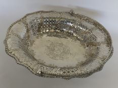 An oval George III silver cake basket on a pierced
