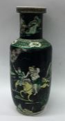 An early Famille Noire vase of typical form decora