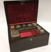 A rosewood travelling vanity case with fitted inte