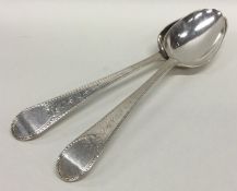 A pair of bright cut Georgian silver spoons decora