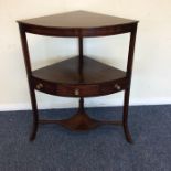 A Georgian mahogany corner wash stand with outstre