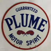A circular "Guaranteed Plume Motor Spirit" metal a