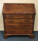 A Georgian mahogany bureau with fall front and bra