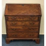 A Georgian mahogany bureau with fall front and bra