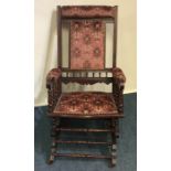 An Edwardian mahogany American ricking chair of ty