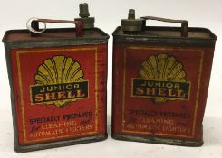 Two small "Junior Shell" oil cans.