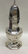 A massive Edwardian silver sugar caster with lift-