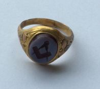 A gilt Masonic signet ring. Est. £20 - £30.