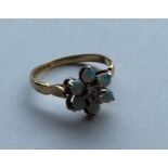 An opal and diamond daisy head cluster ring in 9 c